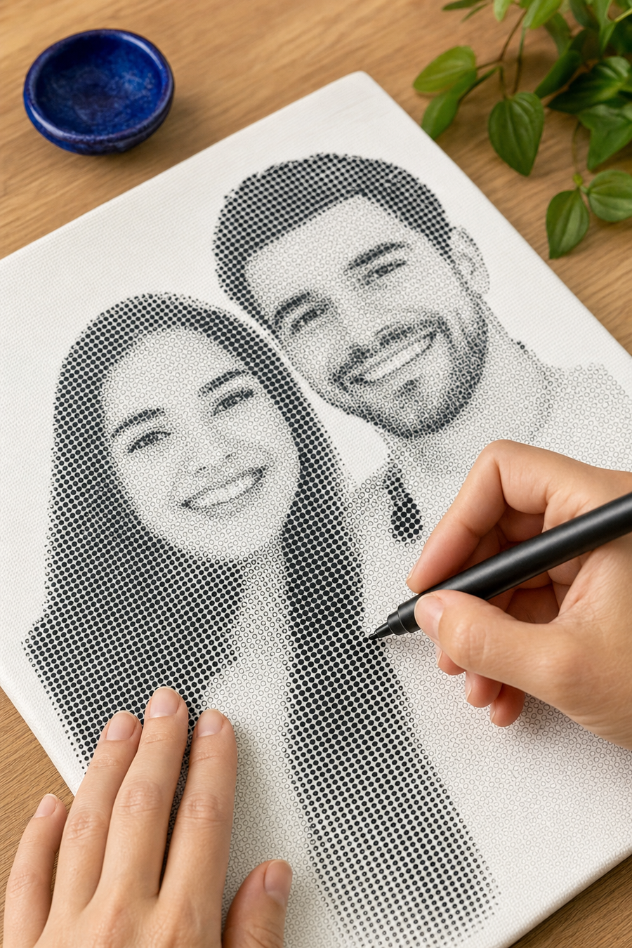Hands filling the printed dots of a custom photo dot painting with a black marker